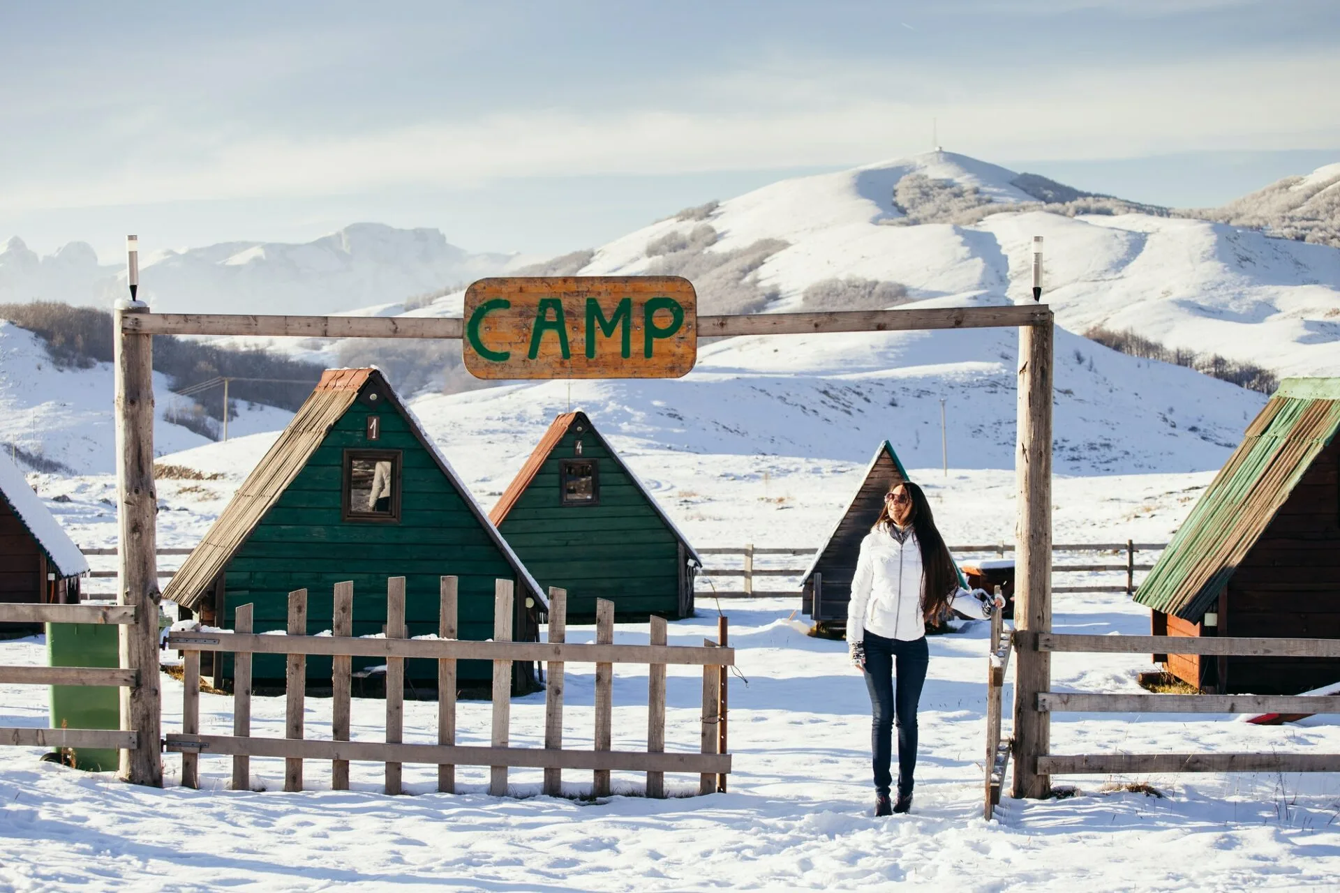 woman play with snow at ski resort camp