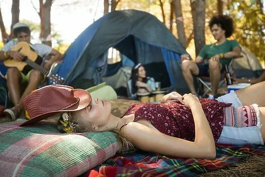 Young woman sleeping while friends sitting in background