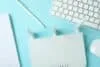Workplace with Wi - fi router on blue background