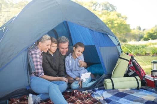 Family taking a selfie in the tent