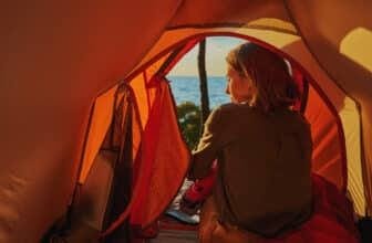 Hiker in tent turned back to camera