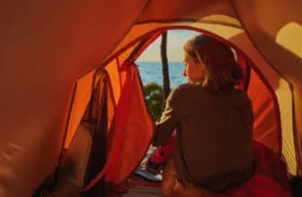 Hiker in tent turned back to camera
