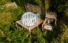 couple man and woman in tent with jaccuzzi in the jungle rain forest, luxury glamping