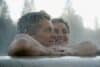 Mature couple relaxing in outdoor spa, portrait