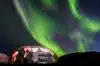 Lit up dome tent, Aurora Borealis in background, Narsaq, Vestgronland, Greenland