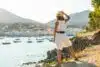 A young woman in a white dress in Cadaques by the sea, Costa Brava of Catalonia