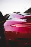 Back view of red Porsche in street