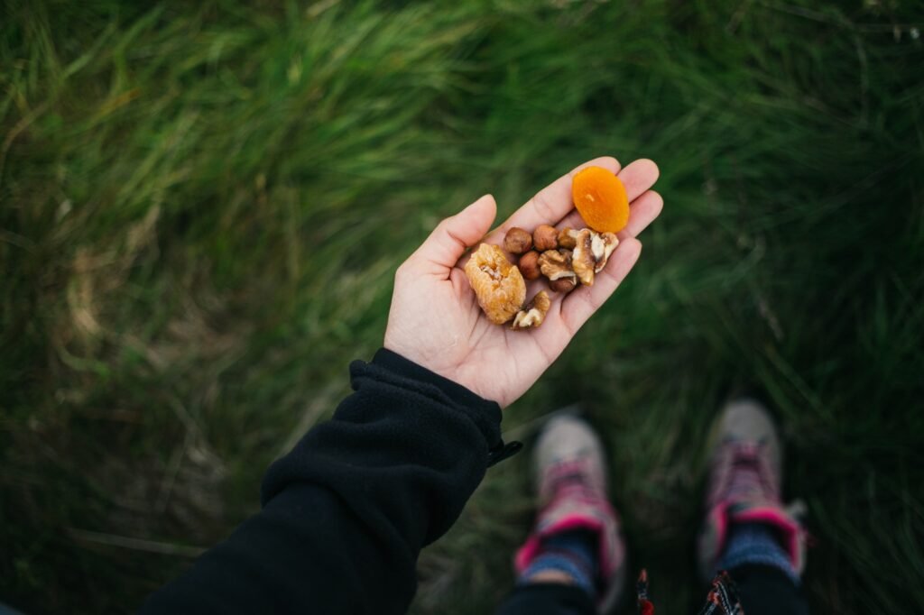 Handful of healthy nuts and dried fruit outdoors