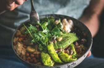 Woman eating healthy vegan dish from bowl, square crop