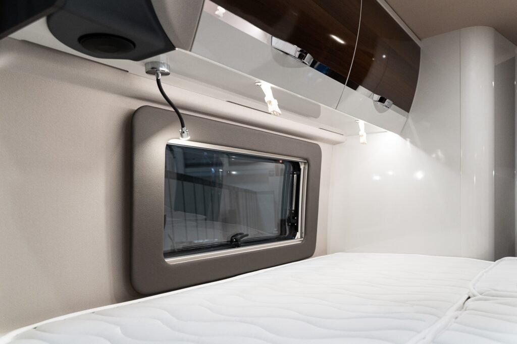 bed near window in luxury RV camper trailer