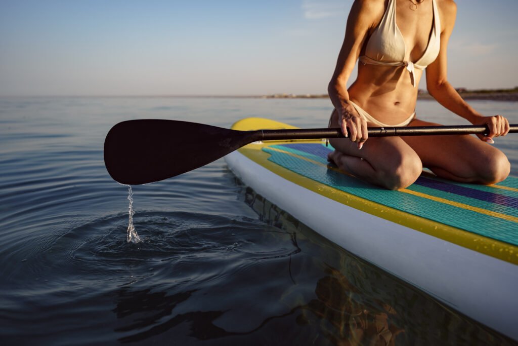 close up of young woman sitting on a stand up padd 2026 03 24 00 22 40 utc - Camping Check