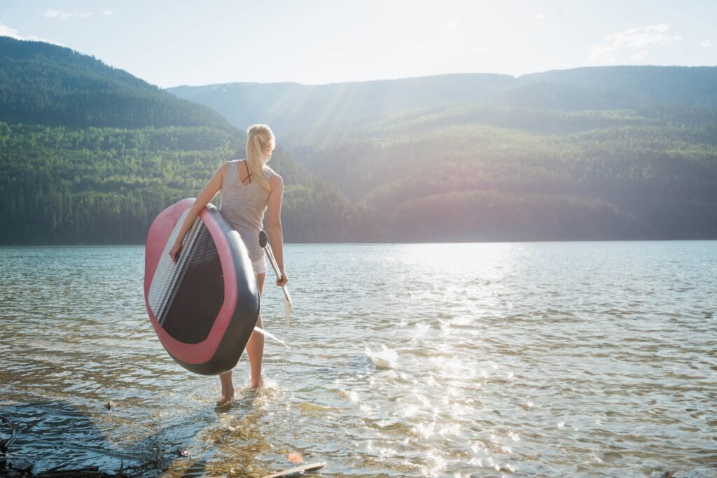 woman with paddleboard enjoys the calm lake waters 2026 03 26 07 59 13 utc - Camping Check